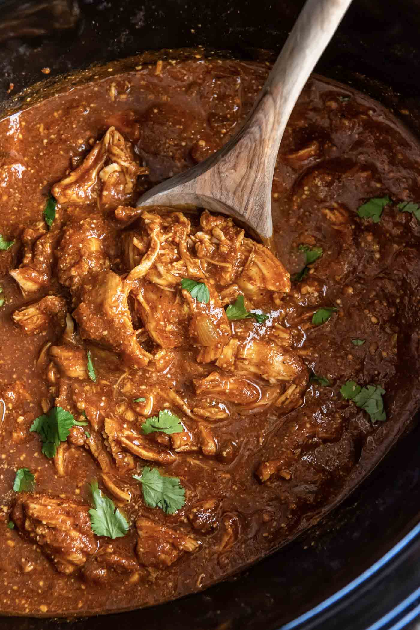 This Slow Cooker Butter Chicken recipe is richly flavored, comforting and easy to make ahead in your crockpot. This Indian dish has a tomato-based curry sauce made with fresh ginger, garlic and spices. Serve it with rice and naan for soaking up the delicious sauce! Butter chicken in a slow cooker.